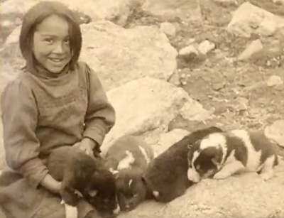 girl holding a puppy